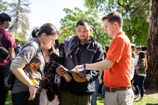 A University of the Pacific admissions officer talks with a family
